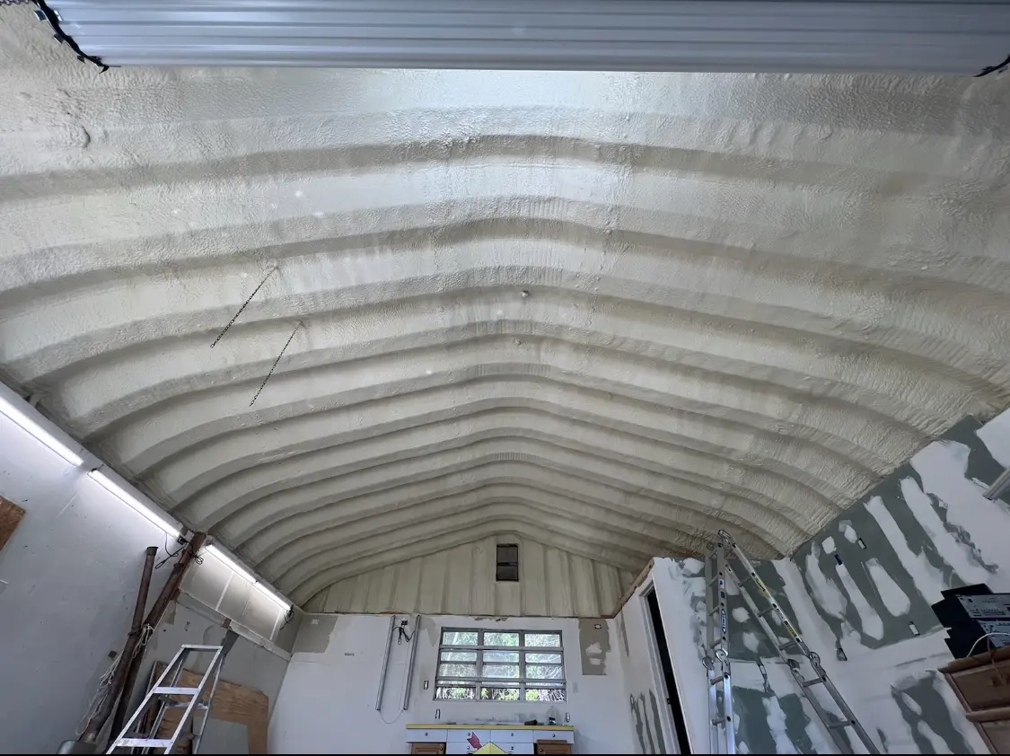 Spray polyurethane foam applied to the underside of a metal roof deck in Belle Chasse